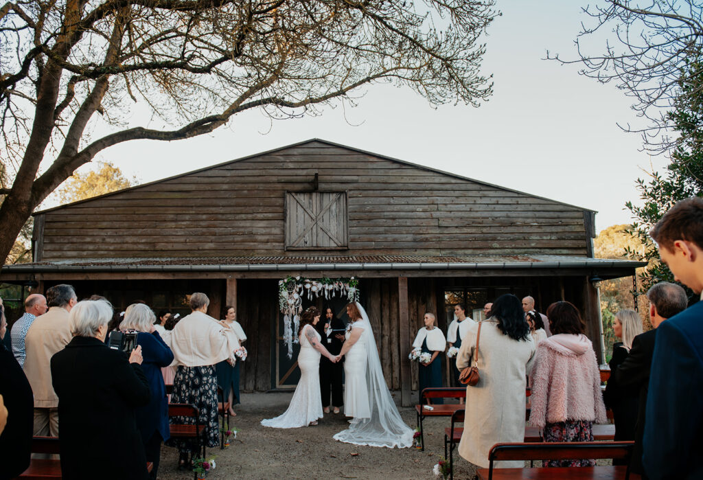 Brides during ceremony at The Farm