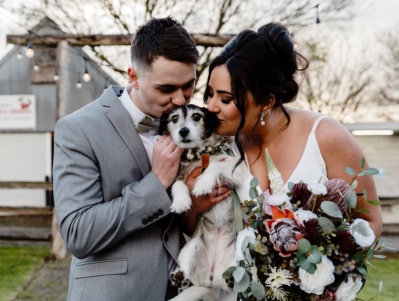 Bride and groom at Big Fella Cherries The Shed with their dog